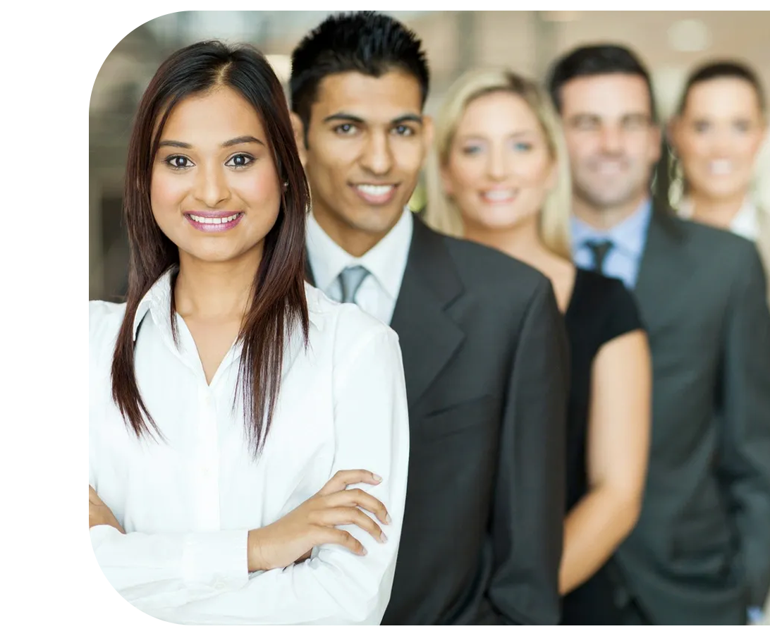 A group of people in business attire standing together.