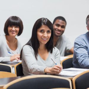A group of people sitting in front of each other.