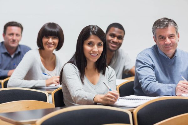 A group of people sitting in front of each other.