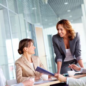 A group of people sitting around a table.